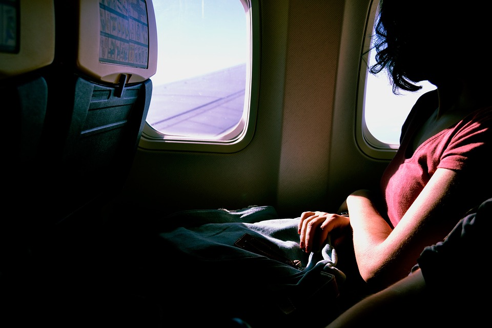 woman sitting in plane